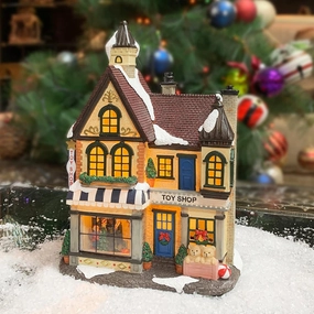 MOMENTS IN TIME 10.8" H Resin Christmas Village Building, Toy Shop with LED Lights - Battery Operated (not Included)